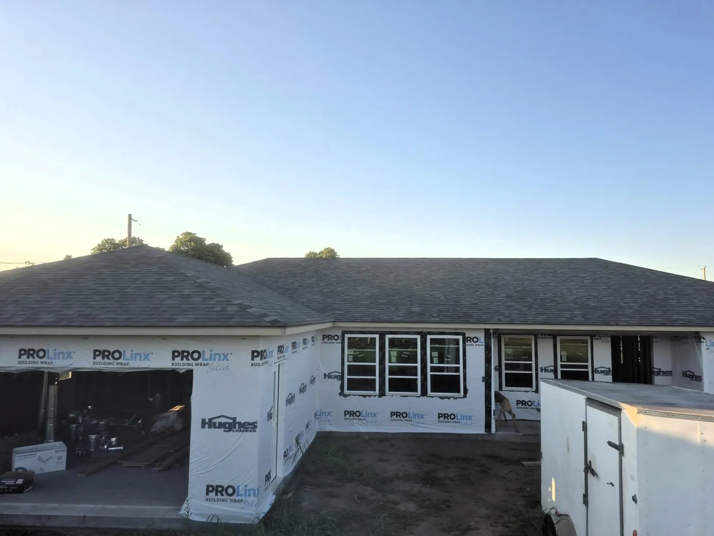 Roof with new shingles installed after storm damage in North Central Oklahoma